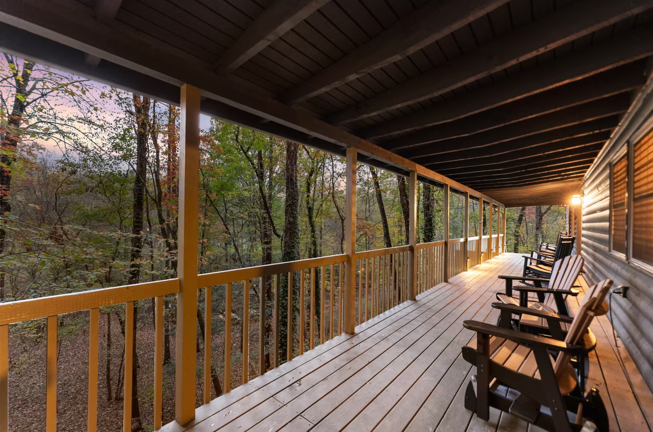 Covered wraparound porch with rocking chairs